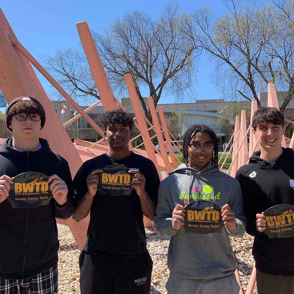 Image of swimmer making muscles