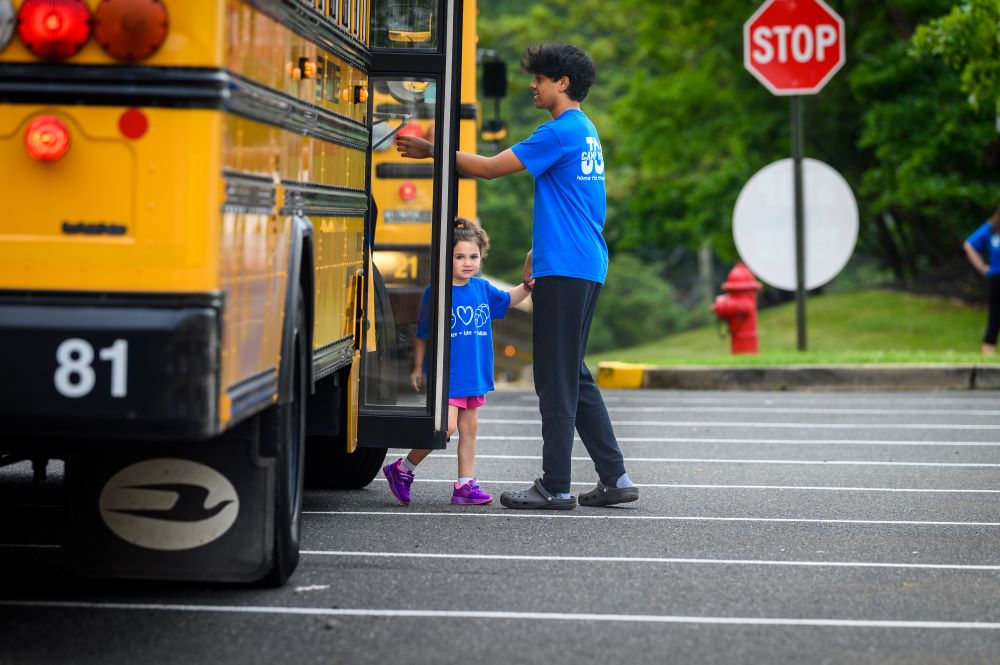 Image of kid getting off school bus