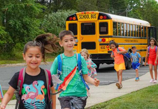 Image of kid getting off school bus